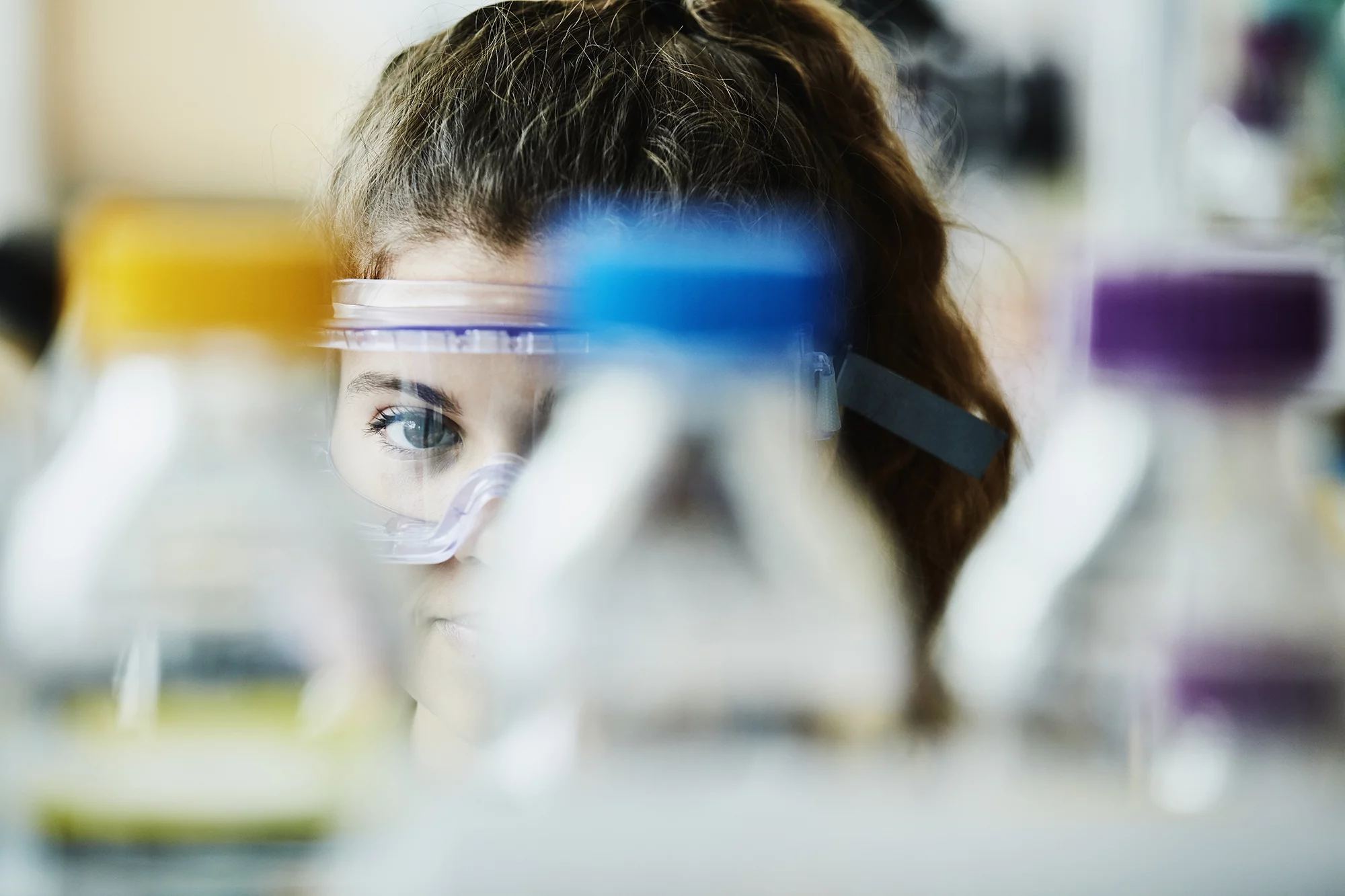 Lab with woman in protective goggles