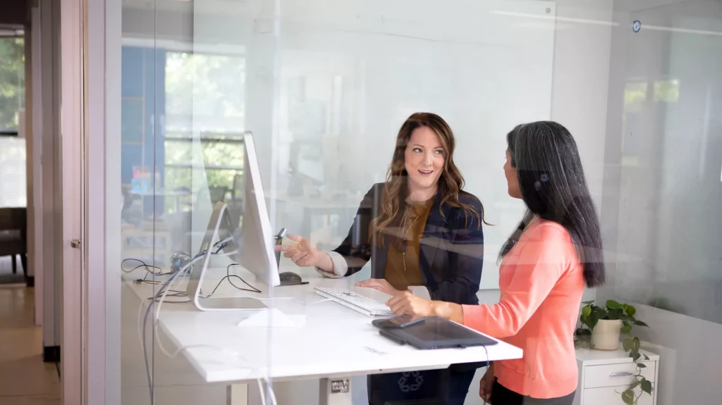 Two women at desk