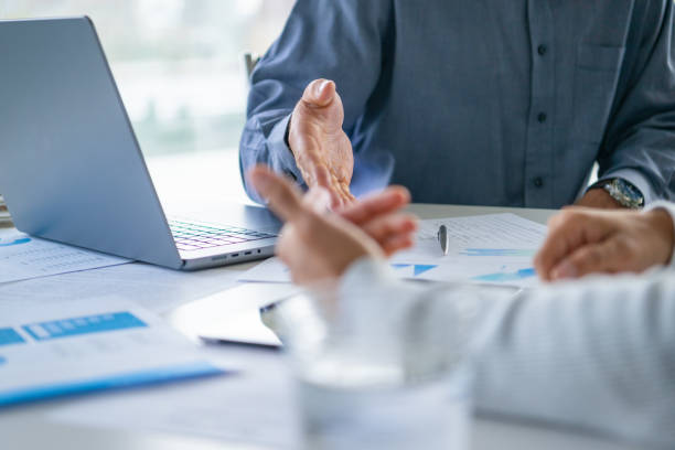 Persons hands at meeting table